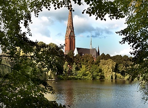 View over the pond to the church St. Gertrud in Hamburg.