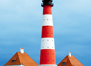 View of the lighthouse of Westerheversand on the North Sea.