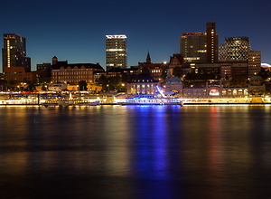 View over the Elb river to the skyline of Hamburg at night.