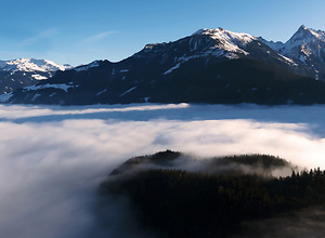Dream landscape on the snowy mountains above the clouds.