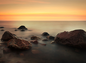 Red sunset makes stones disappear at the Baltic beach.
