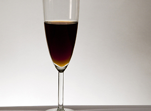 A champagne glass filled with Coke.