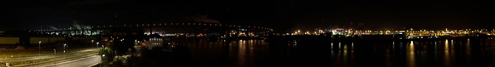 Köhlbrand bridge and Hamburg harbor at night